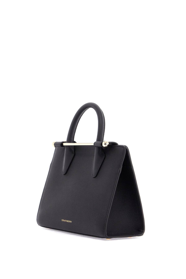 mini tote structured in black leather with gold details-2